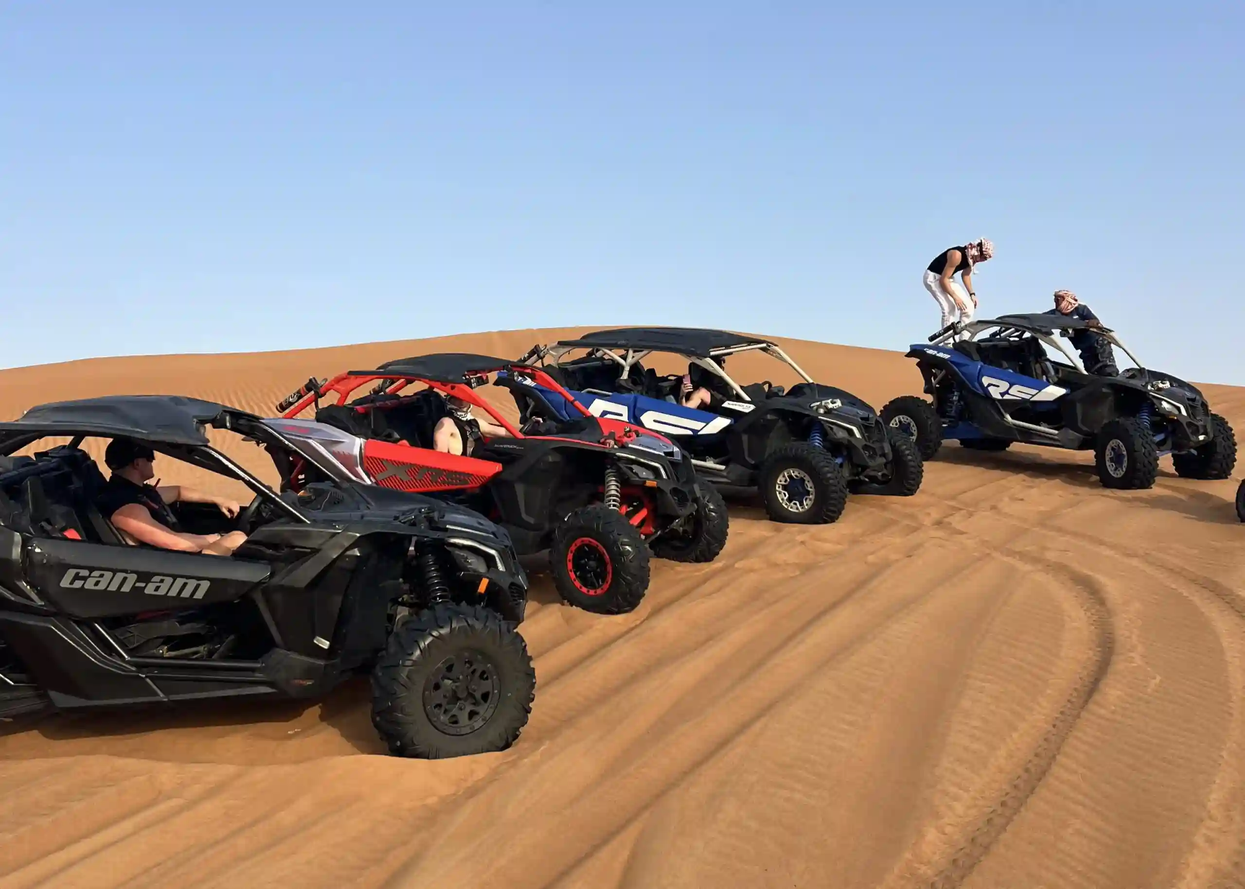 Dubai dune buggy tour driving across red desert dunes in a Can-Am vehicle